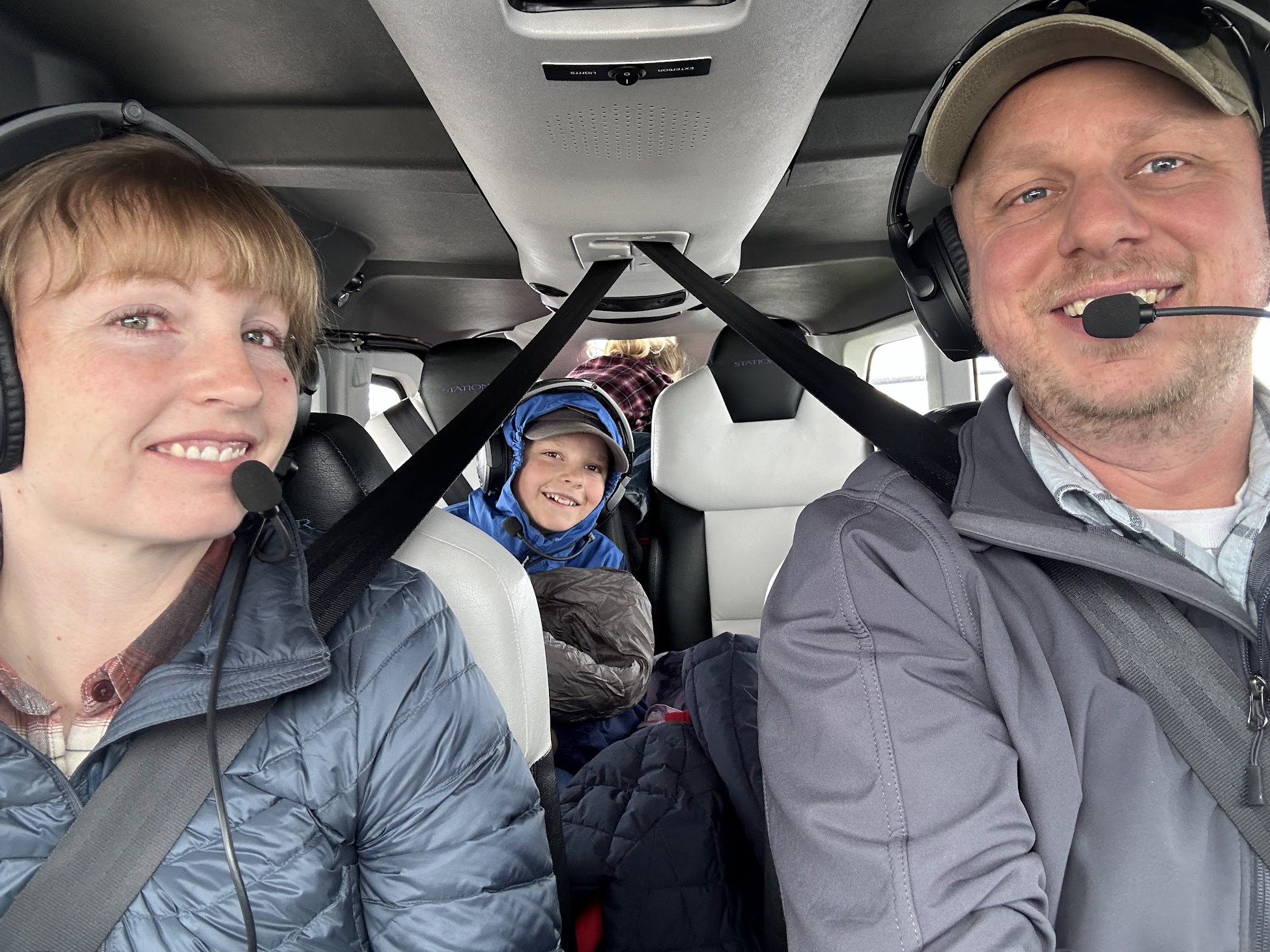 Brent Neely flying with two of his children